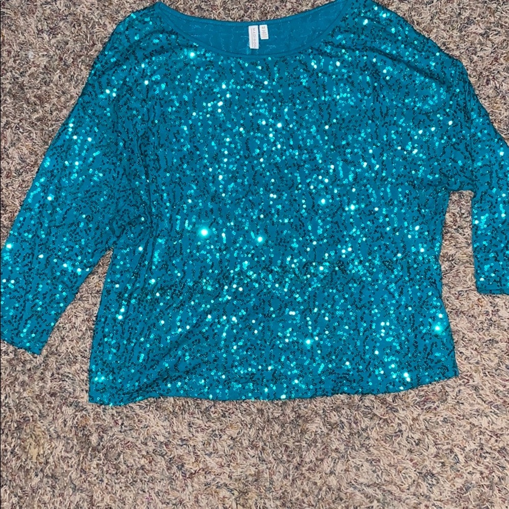 Green sequin top with 3/4 sleeves.